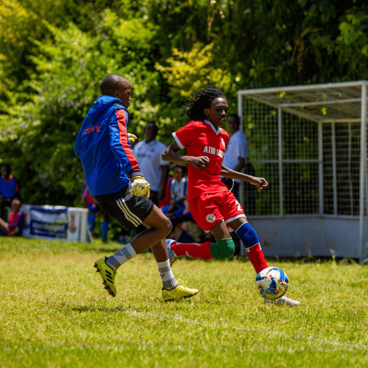 young footballer dribbles past opponent